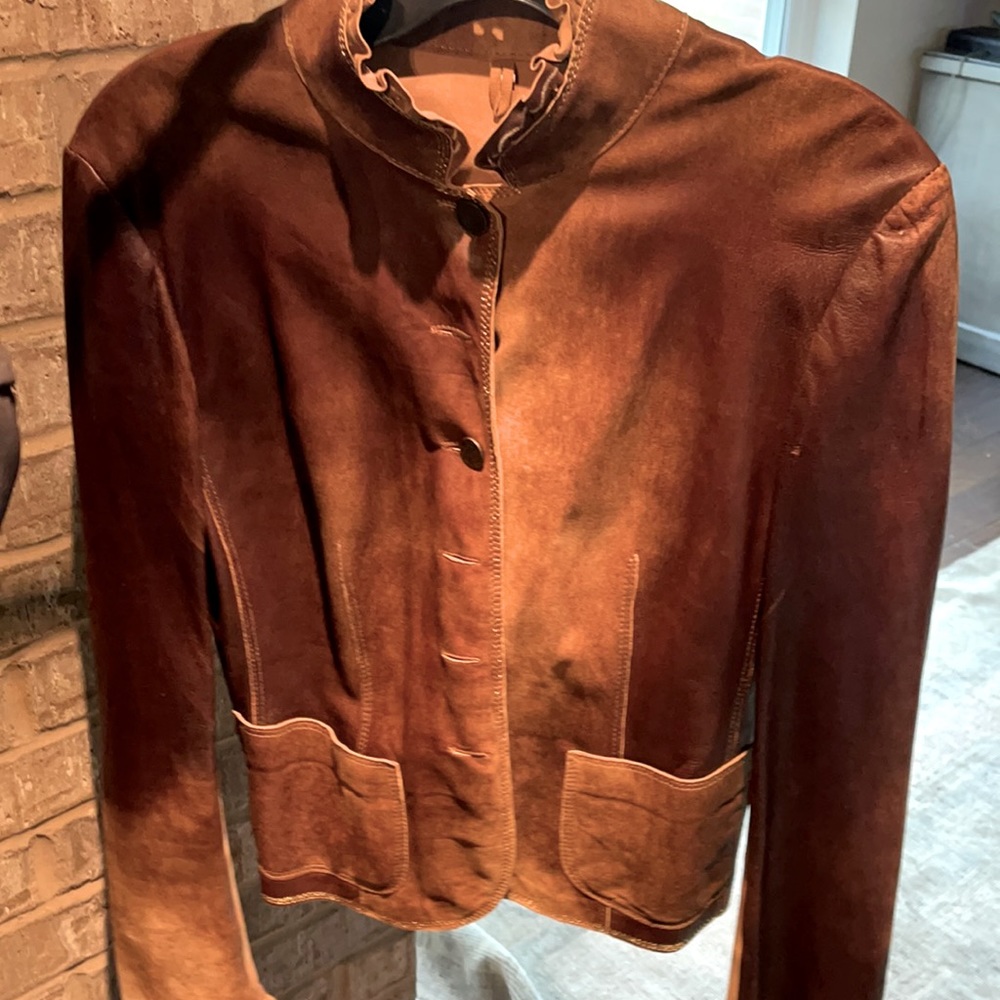 Italian brown buttery soft leather jacket with buttons and neck ruffle.